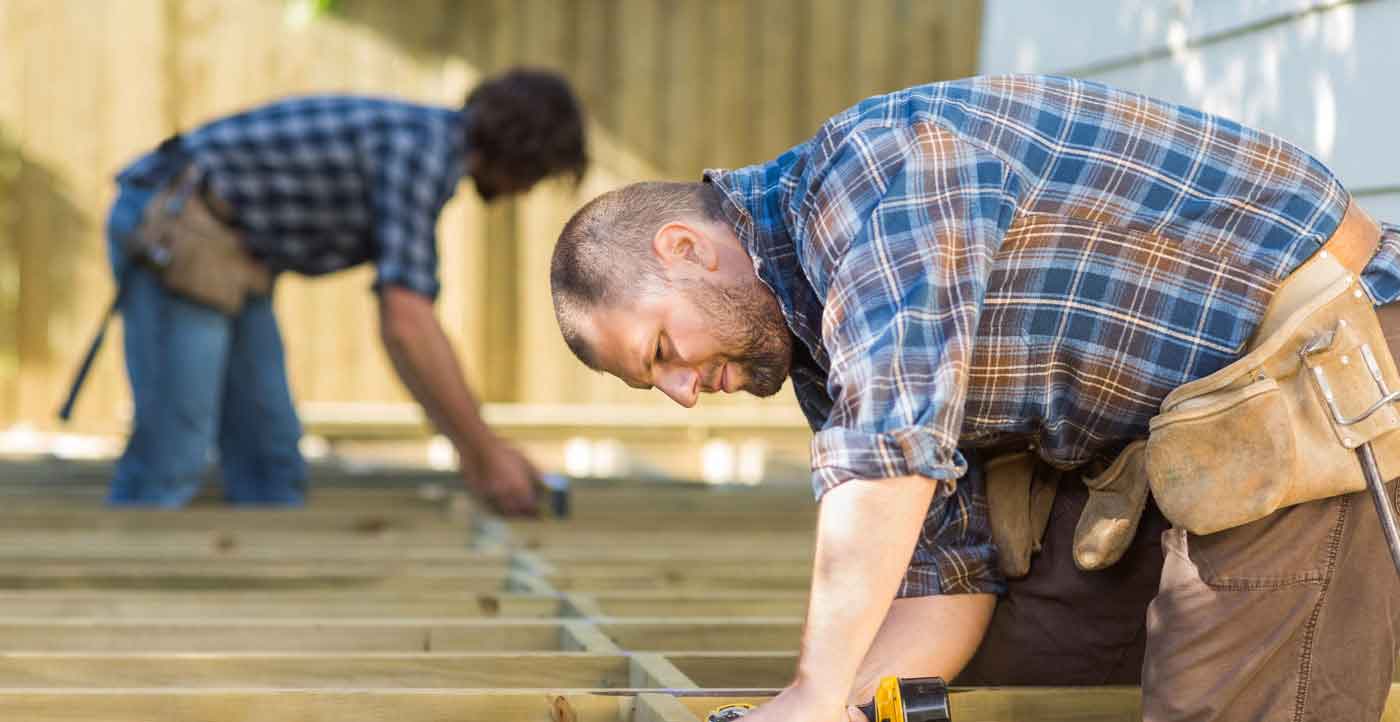 construction workers framing floor joists