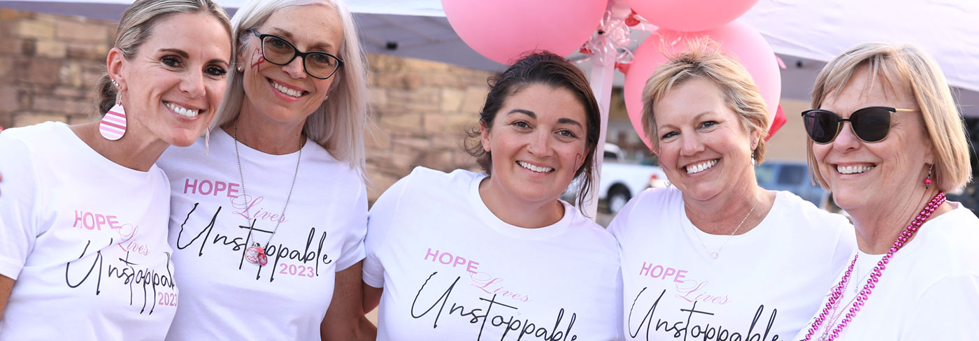 smiling women in 'hope' t-shirts
