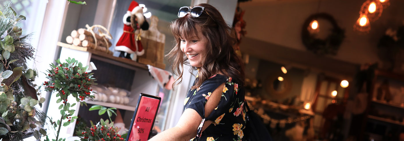 happy shopper in christmas store