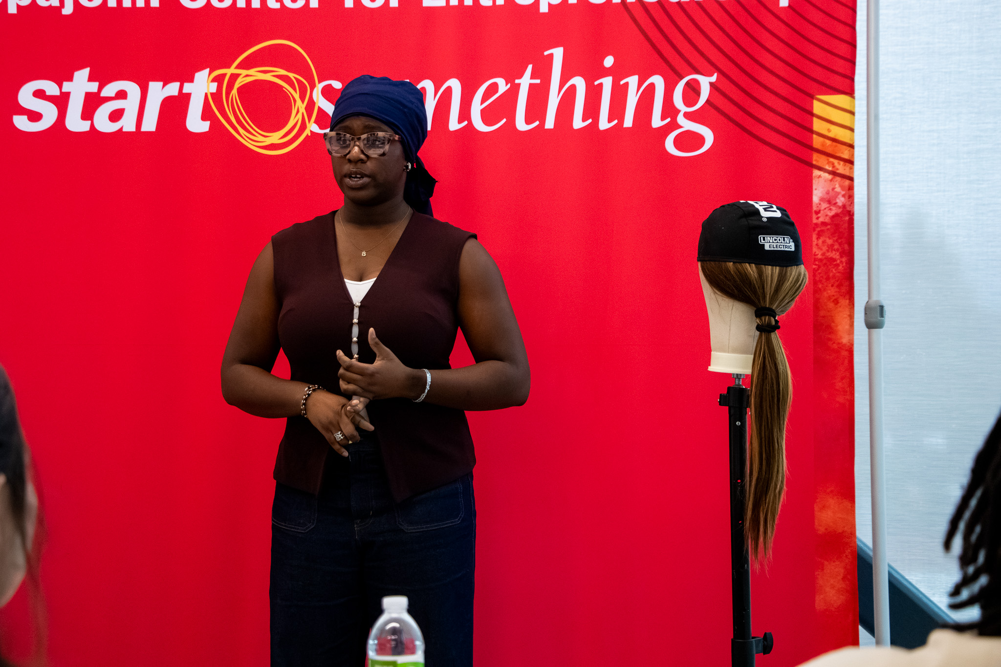 Click the Defying Norms: OEI Alum Builds SparkDefy Slide Photo to Open