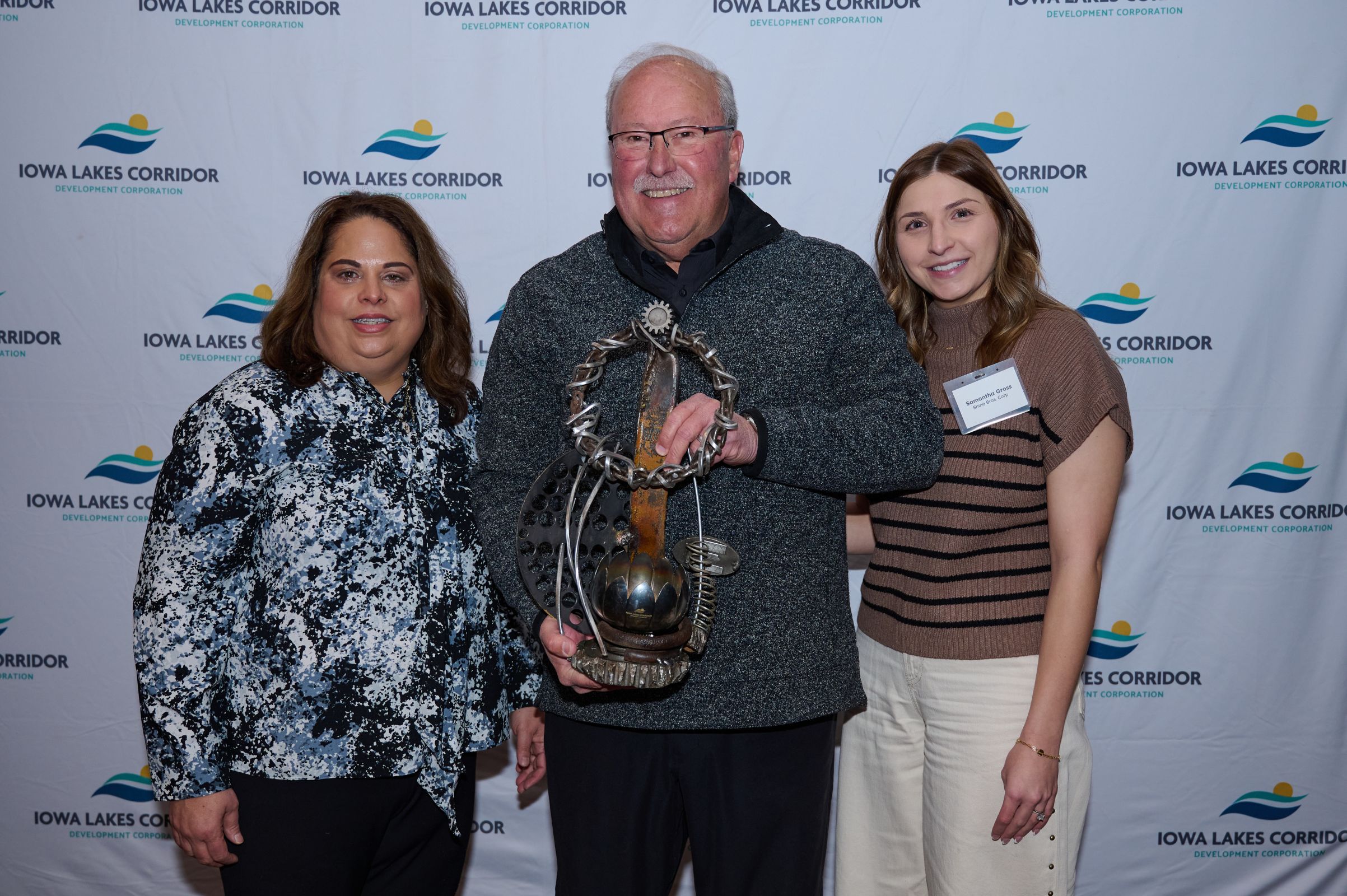 Corridor's Lifetime Impact Award presented to the family of Toby Shine by Bruce Tamisiea