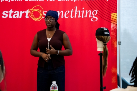 Click the Defying Norms: OEI Alum Builds SparkDefy Slide Photo to Open