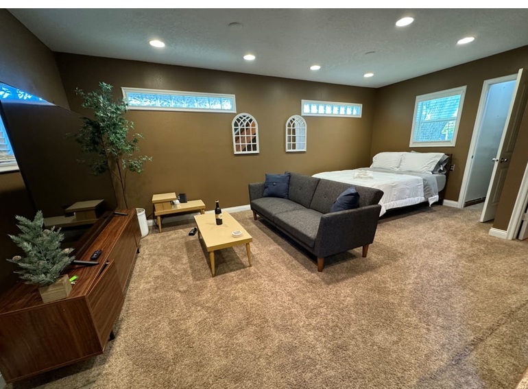 AirBnb Little Cabin in Town's Logo