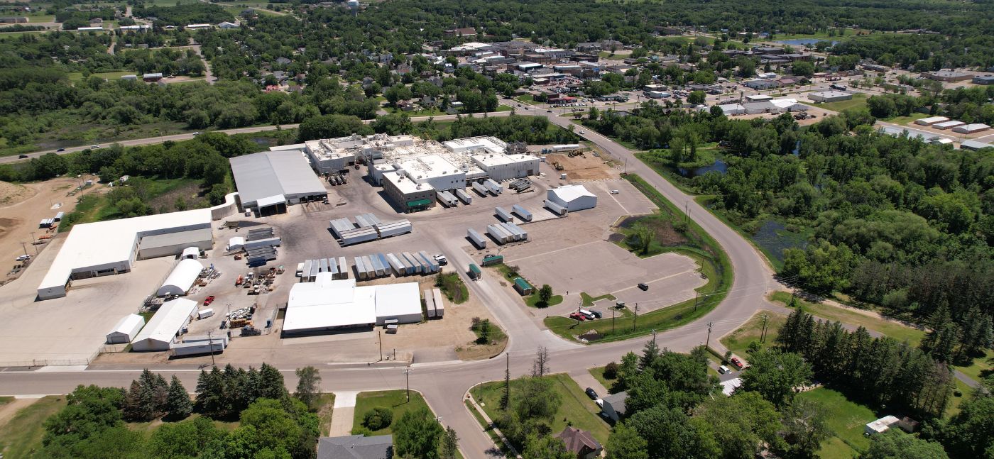 aerial shot of packing plant and the city of Long Prairie