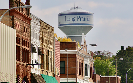 Increased Housing Demands Signal Positive Growth for Long Prairie Images is a downtown scene with the water tower.