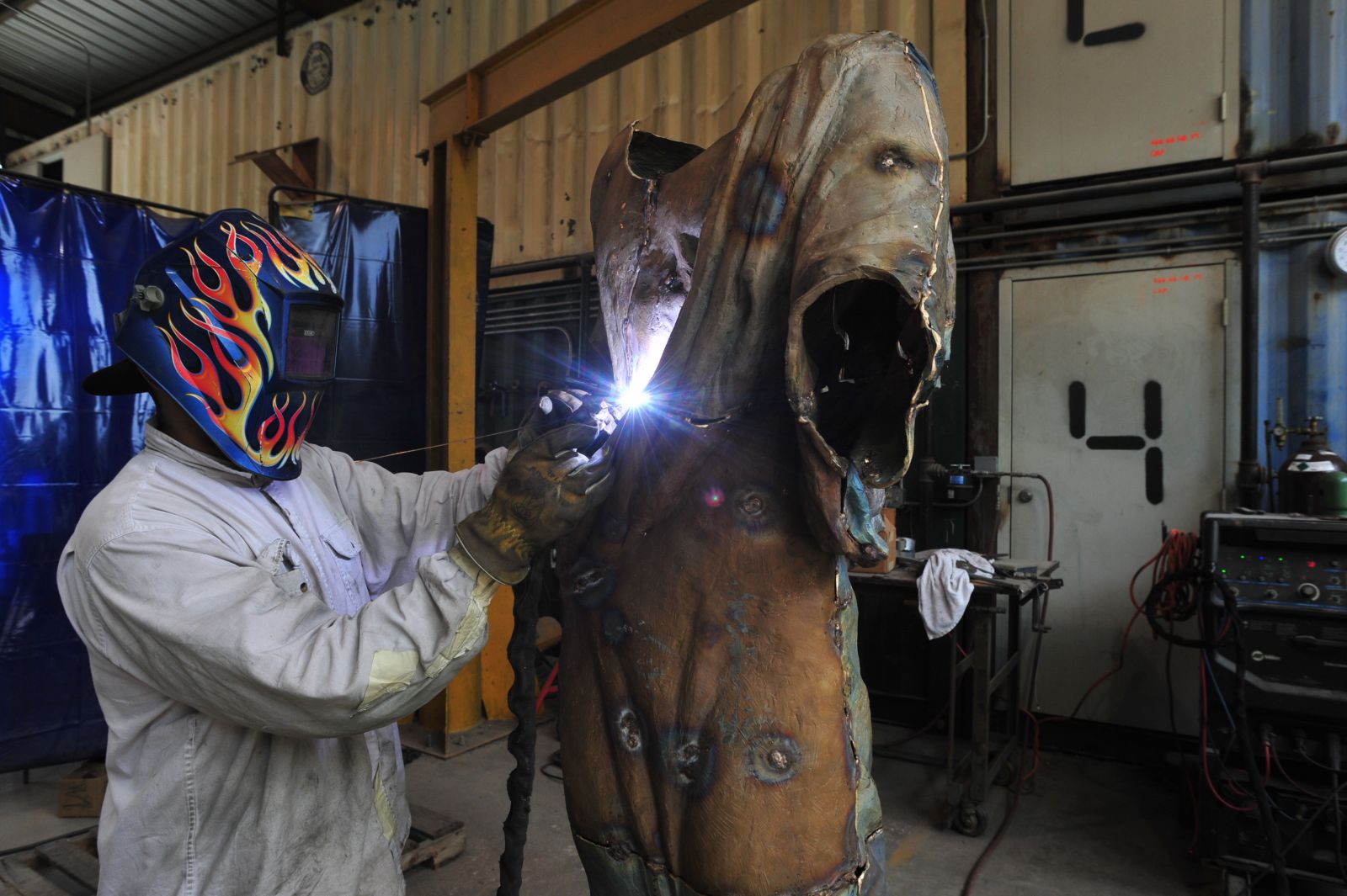 An employee at the Deep in the Heart Art Foundry works on a new piece. (Photo by Terry Hagerty Photography)