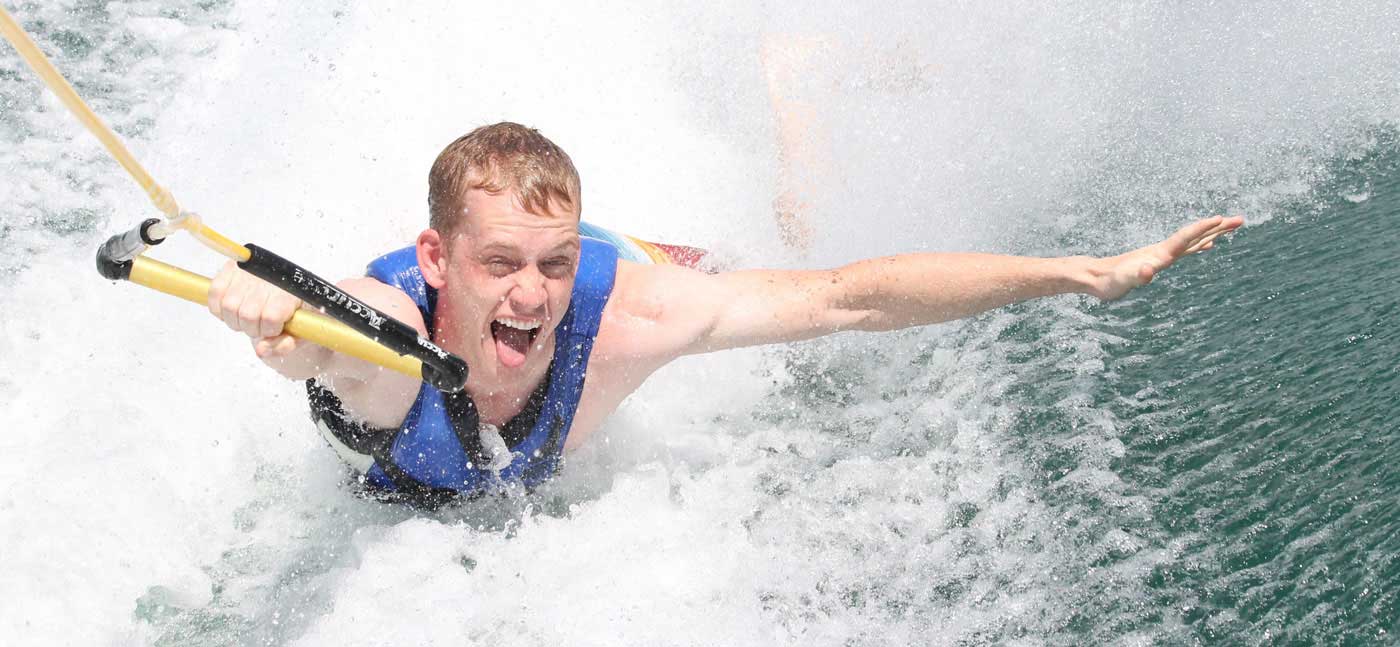 young man waterskiing