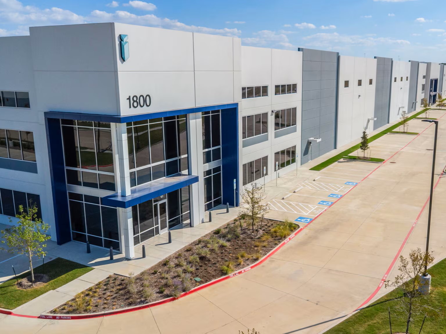 Exterior shot of an office/warehouse at 1800 State 121 Hwy.