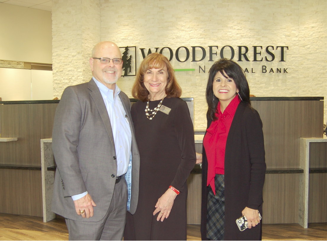 Pictured at the soft opening of the newly re-built Woodforest National Bank building in Downtown Conroe are bank representatives Jay Dreibelbis, President and CEO; Linda O’Dell, Conroe Downtown Branch Manager; and Patricia Brown, President of Conroe.