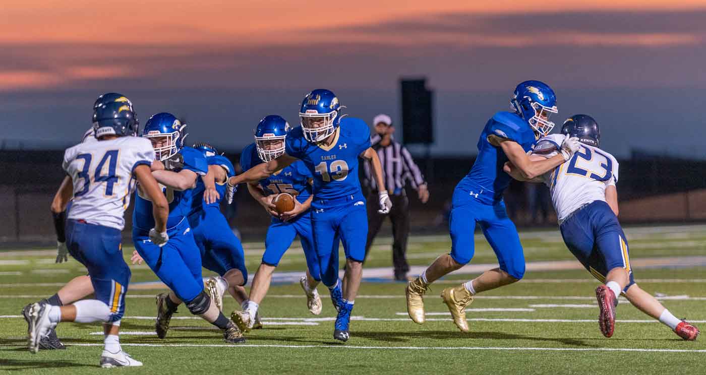 high school football at sunset