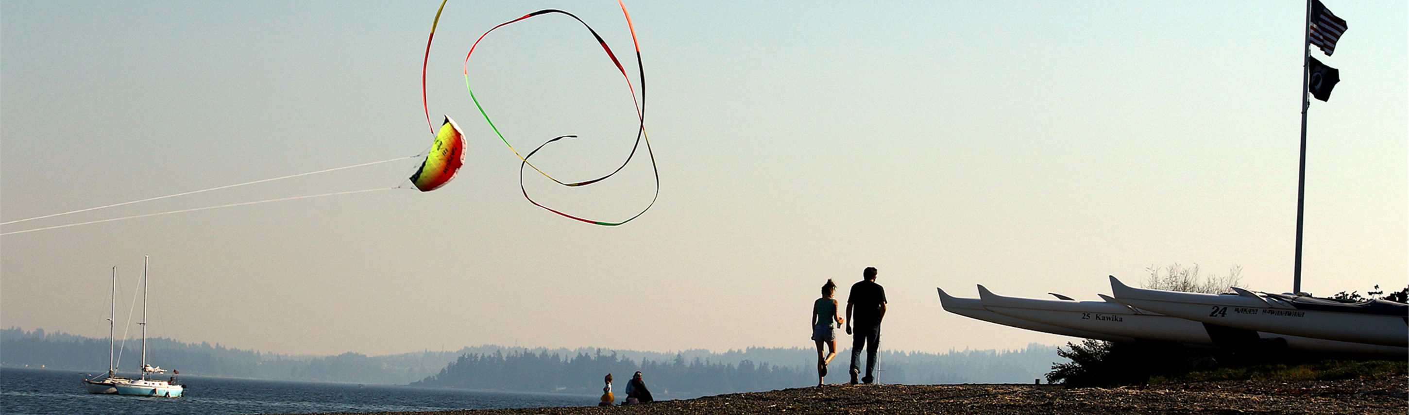 couple on beach, kite, sunset, sailbot