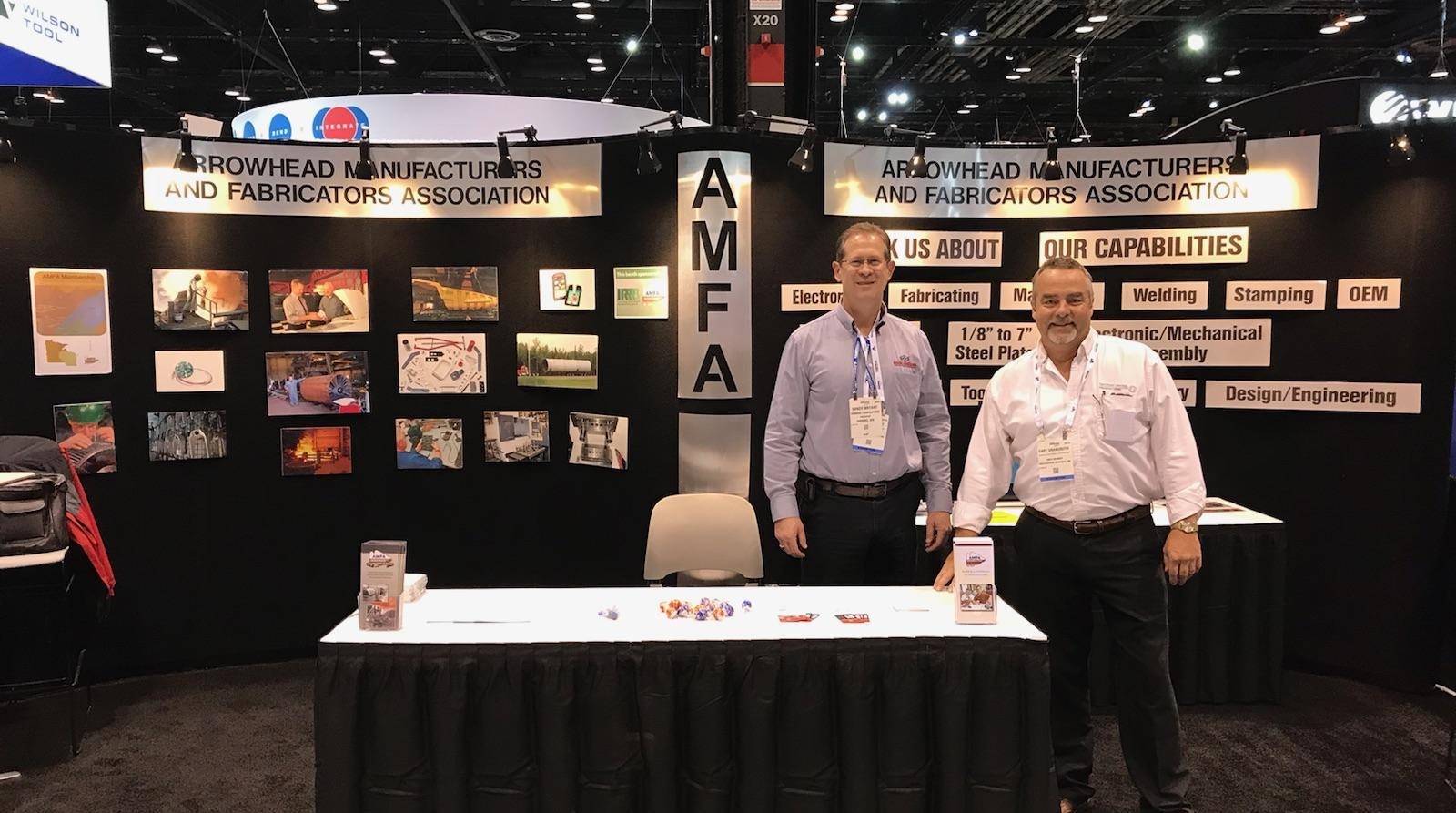 Representatives from Arrowhead Manufacturers and Fabricators Association stand at their booth at FABTECH 2017.