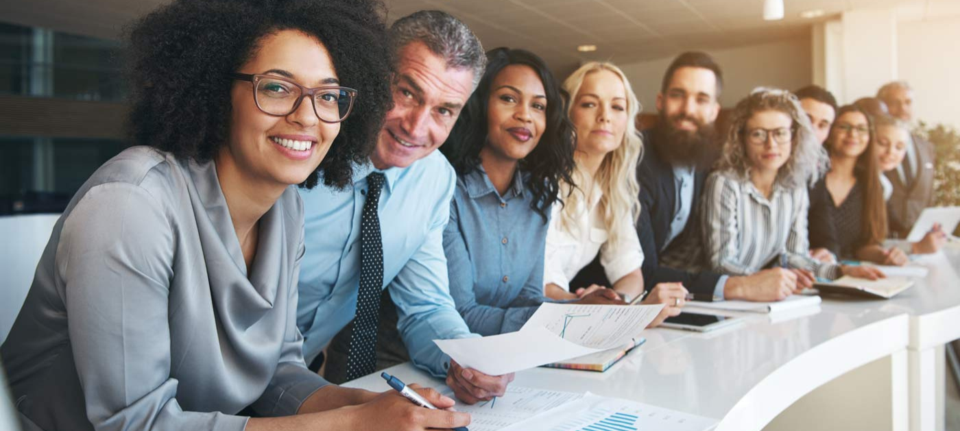 group of smiling business peers