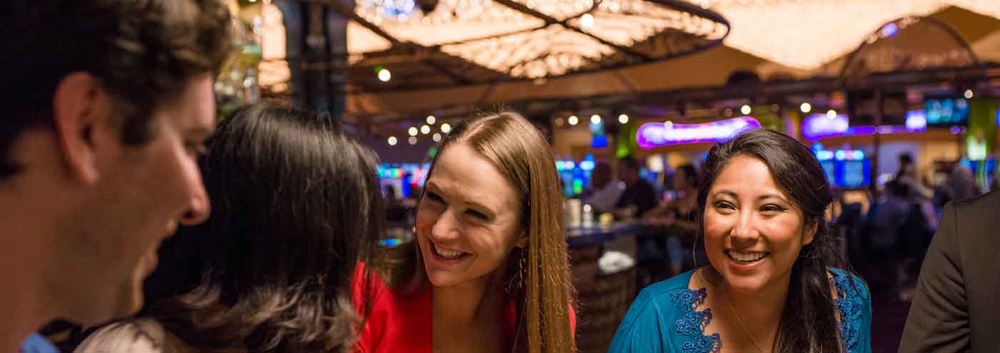 Smiling friends at a gaming table