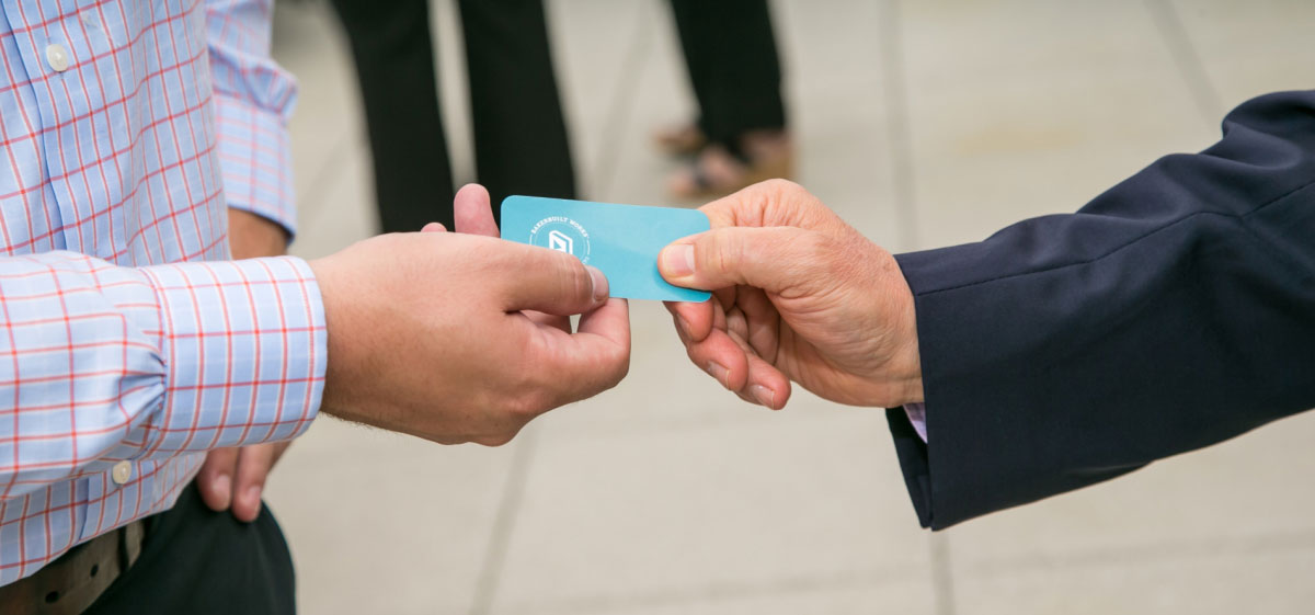 people sharing business cards