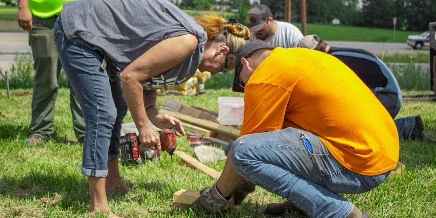group of people working together on construction