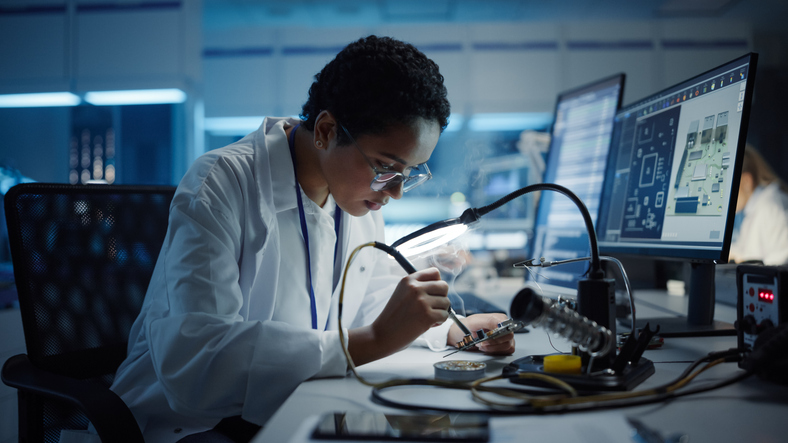 Engineer is soldering a computers motherboard in Greater Portland