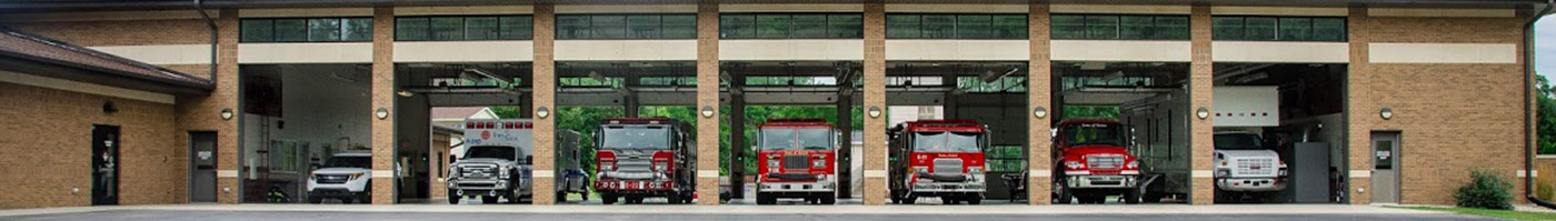 fire station garage with all doors open and trucks in their stalls