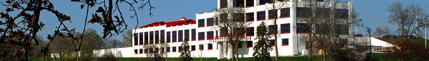 large white building with red framed windows