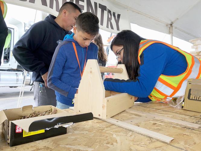 The Community Construction Zone event is set for Oct. 7 in downtown Beloit. Young people will get hands-on experience in construction trades, as seen in this file photo from last year. This photo shows a child building a toolbox.