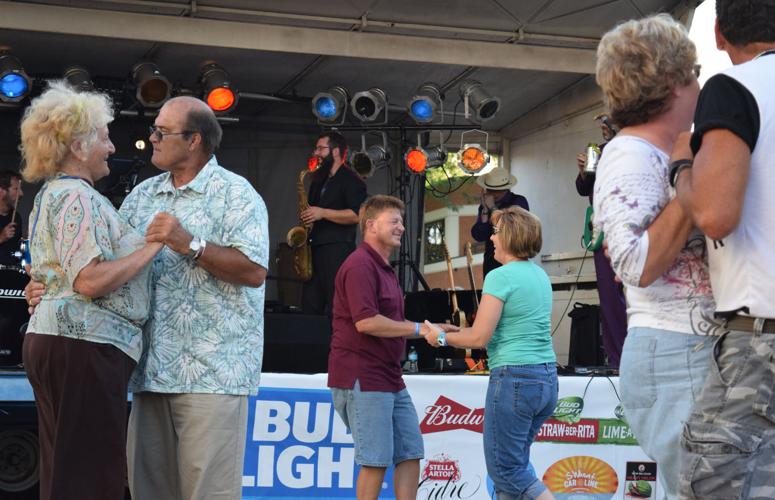 Dancers move their feet on the red brick street at a previous Downtown Beloit Association Street Dance. This year the street dance will be held Friday, Aug, 2 with the first band starting at 5:30 p.m. BDN file photo.