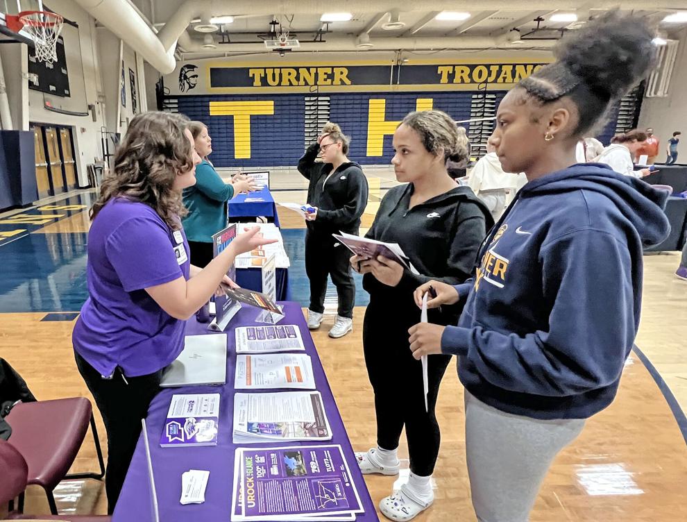 UW-Whitewater at Rock County pre-college coach Emily Matteson speaks with Turner High School students Amari Hanson and Maliah Barnes about classes and programs at the university’s Janesville and main campuses during “Career Exploration Day.”  Ryan S