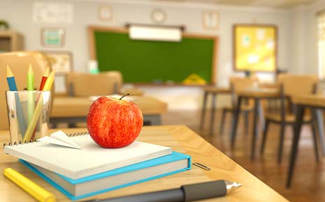 Chalkboard, apple, pencils, and books