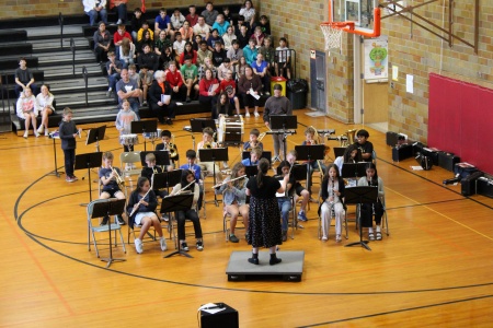 kids in orchestra in gym