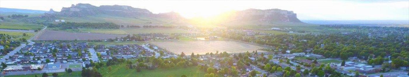 arial view of town and monument with sunrise