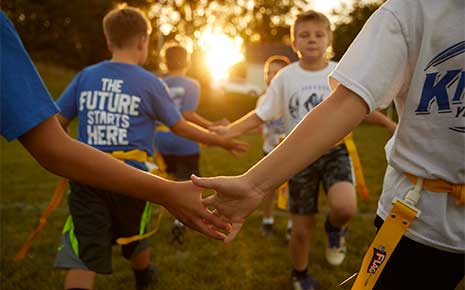 kids shaking hands after a good game