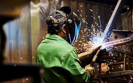 Welder wearing face protection