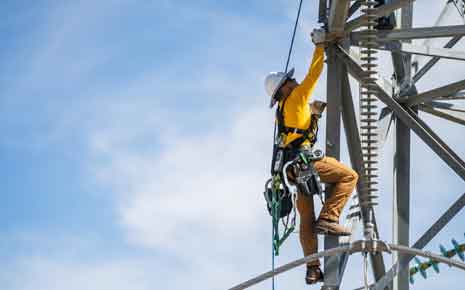 worker on power lines