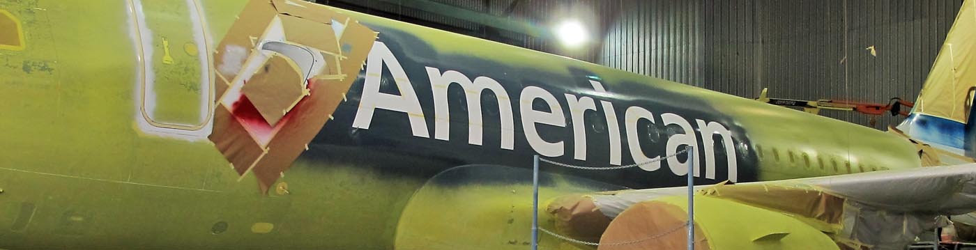 american airline aircraft being painted