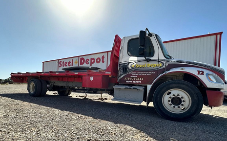 The image shows a medium-duty commercial rollback flatbed or tow truck belonging to Steel Depot in Roswell, New Mexico, built on a Freightliner Trucks Business Class M2 chassis.