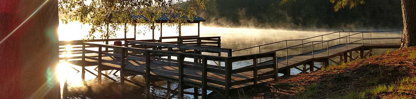 morning sun on lake and dock