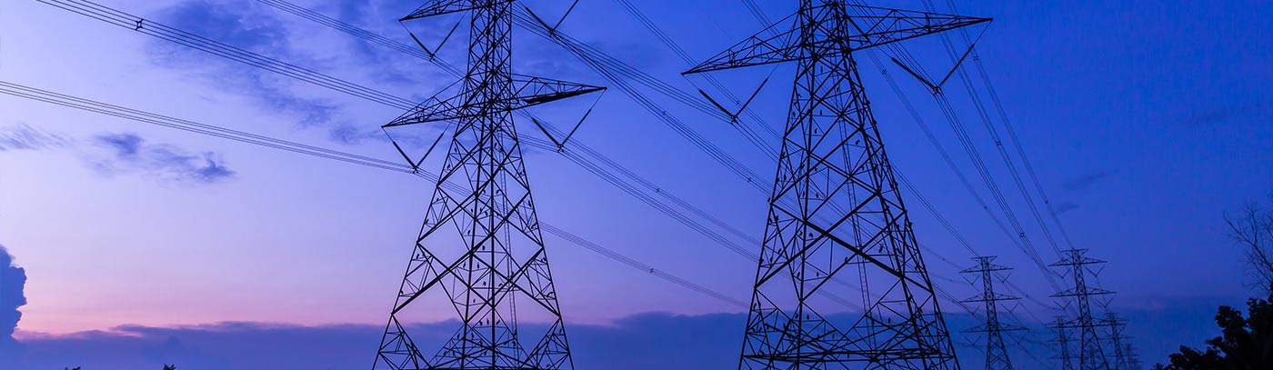 two sets of power lines at dusk