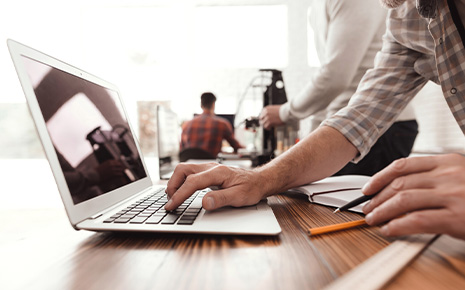 office workers on laptop and computers, cad machine