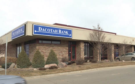 Click the Dacotah Bank opened new branch when many major bank branches are closing; market president explains slide photo to open