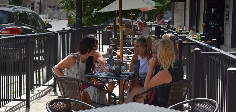 people relaxing at outdoor cafe