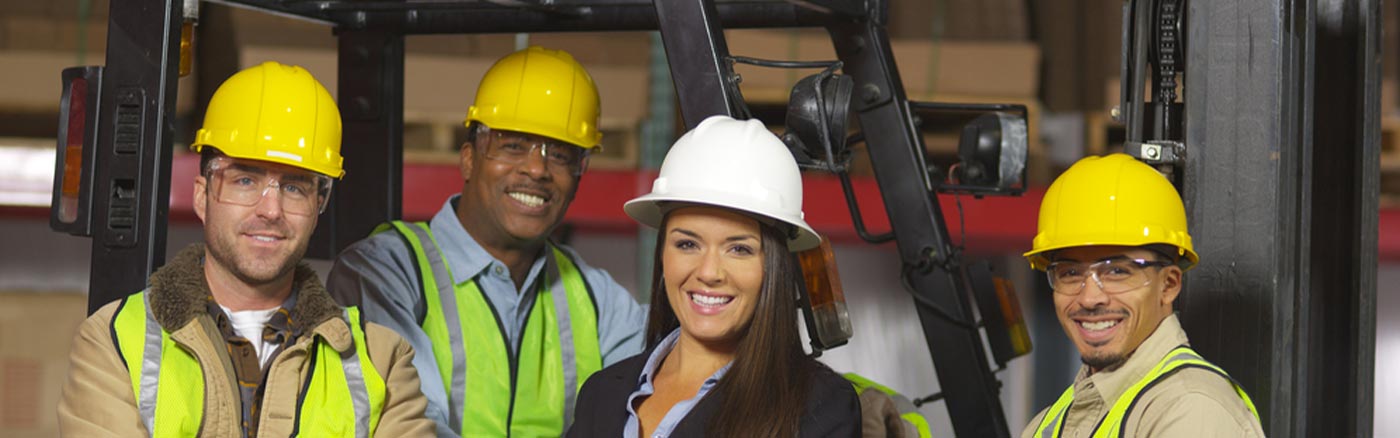 ethnically diverse workers in hardhats