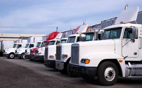 parked semi-trailers outside warehouse