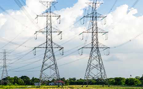 high-voltage power lines in farm field