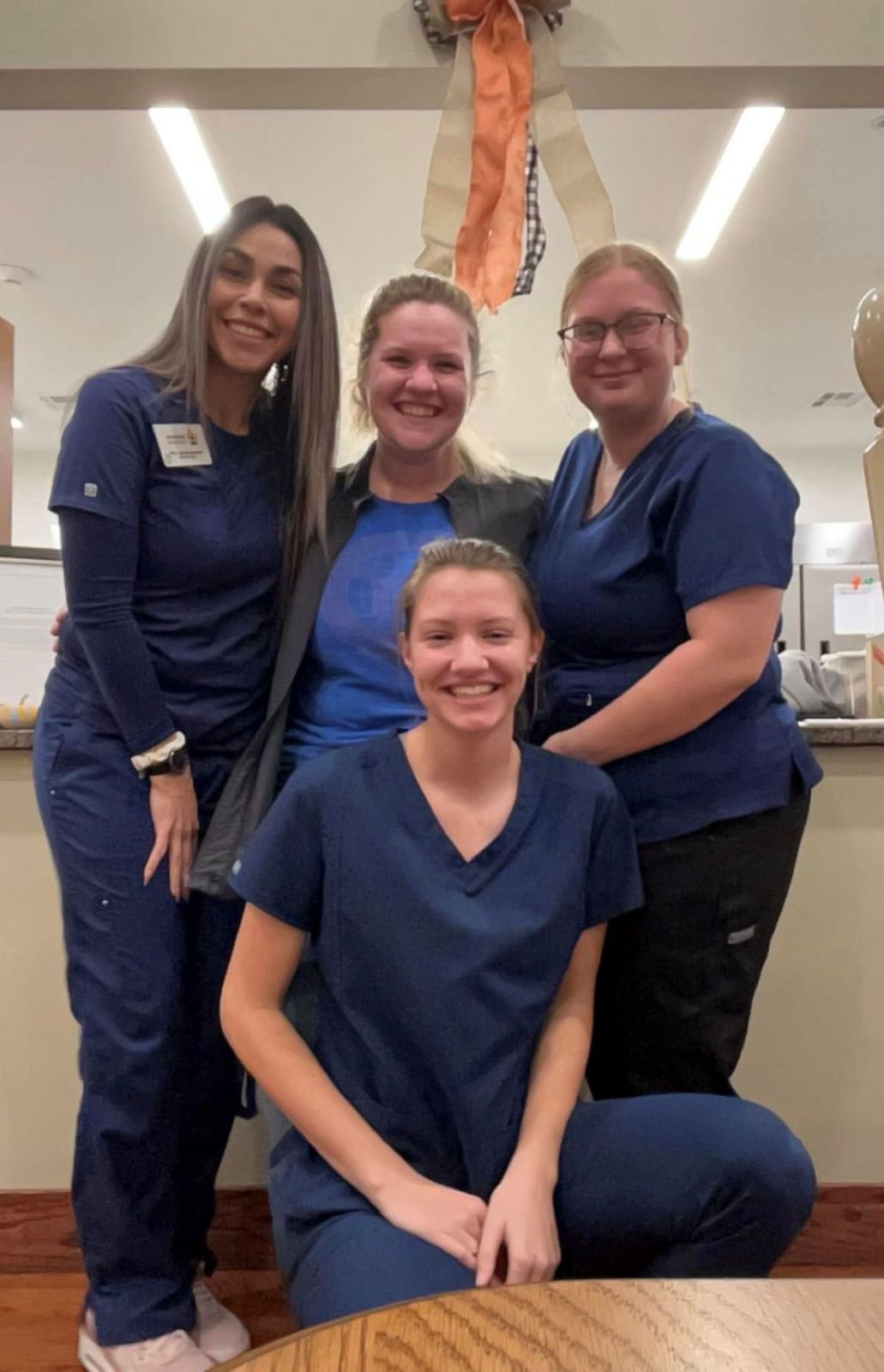 Staff members posing and smiling