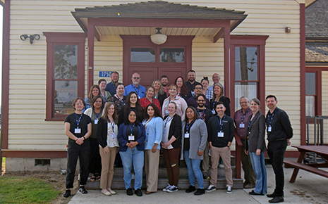 Class photo of Leadership Skagit participants gathered in front of historic Skagit City School