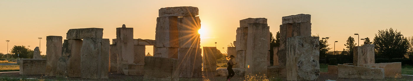utpb stone henge and runner at sunset