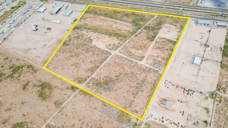 aerial view of undeveloped land with a yellow border marking the property edges