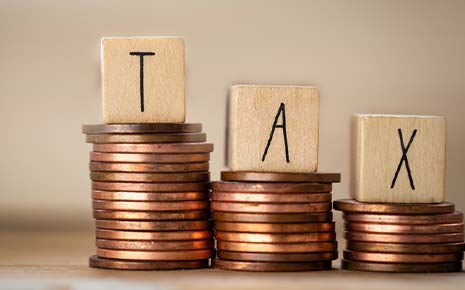 tax blocks on stacks of pennies