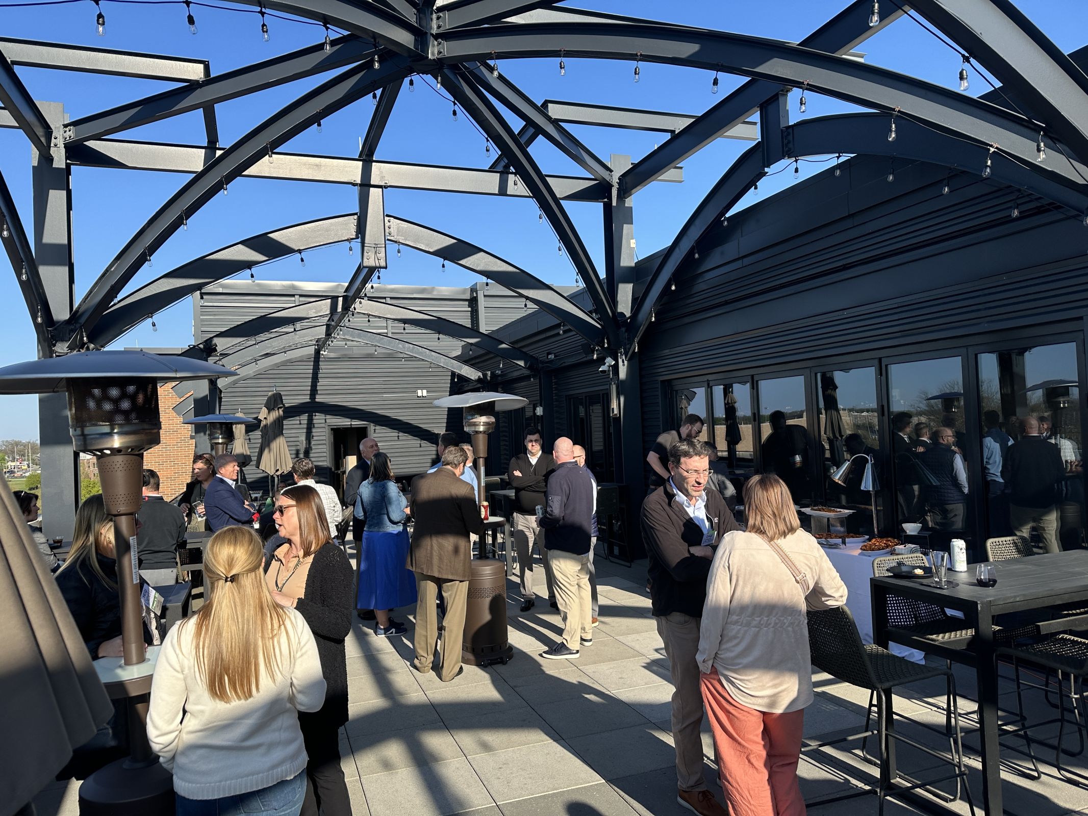 IEDA 2024 Spring Conference attendees congregate at the rooftop lounge at Embassy Suites by Hilton South Bend at Notre Dame on April 25th, 2024.