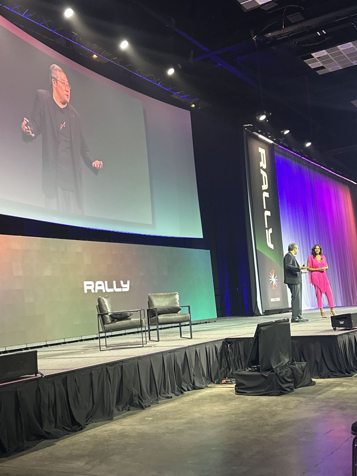Writer and AI startup investor Chris Yeh wraps up a session called 12 Mindshifts for the AI Age with event MC Jennifer Magley.