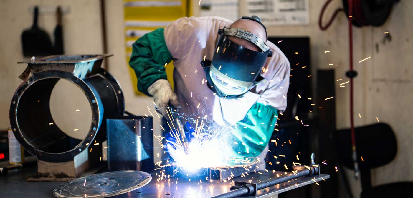 welder working with sparks flying